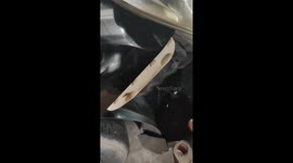 Mechanic rescues kitten trapped in car bumper