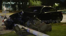 US, Los Angeles: Woodland Hills BMW Crashes Knocking Down Traffic Light