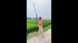 Chinese man displays impressive strength by climbing a pole