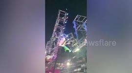 Metal frames collapse over concert stage during storm