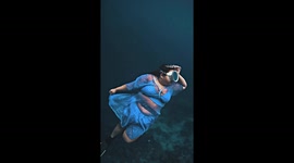 Plus size swimmer performs captivating free diving exhibition