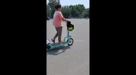 Shopper glides through traffic on electric walking bike