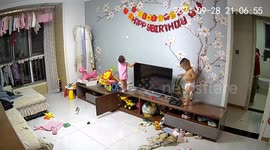 Children's playtime mishap results in a TV falling in Shaanxi, China