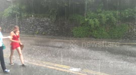 Torrential rain soaks girls in Ambleside