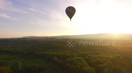 Stunning drone footage of hot air balloons before sunset