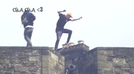 Man rides skateboard on top of Edinburgh Castle