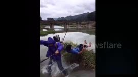Fisherman catches friend's head with his net and makes him fall