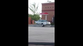 Car gets stuck on a drive-through ramp