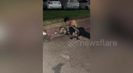 Drunk Chinese man wrestles with huge python