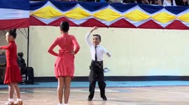 Talented kid energetically dances during competition
