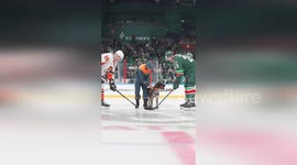 Hockey game starts with police dog dropping the puck from its mouth