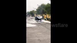 Firefighters extinguish burning wreckage of helicopter after it crashed in eastern China