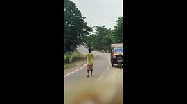 Wild rhino attacks motorcycle ride in nature sancturay in India