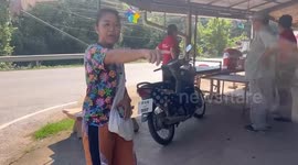 Snake sparks panic as it slithers into female rider's scooter
