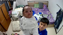 Adorable moment husband shows baby to CCTV for wife to see