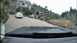 Driver leaps for his life as heavy lorry rolls backwards downhill