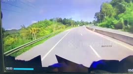 Motorist drives over road as it starts collapsing