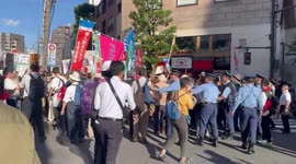 Protester pushed down by police at Anti-war protest in Tokyo