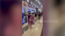 Doting girlfriend prints A2 size poster to greet partner at airport