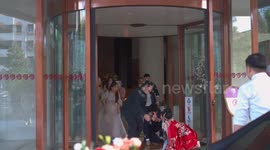 Groom drops bride while trying to piggyback her in epic wedding fail