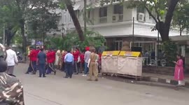 Indian industrialist Ratan Tata's body escorted by police through Mumbai