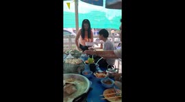 Birthday cake candle sets woman's hair on fire