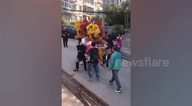Crying Chinese bride tied to telephone pole during bizarre wedding ritual