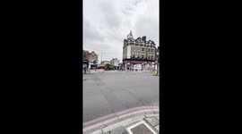 Cow Balloon Floats Backwards Over Street