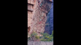 Lifelike giant Buddhas carved on cliff in China's Gansu