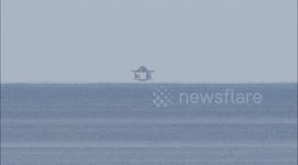 Distant naval fort appears to levitate in Fata Morgana illusion off Kent, UK