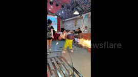 Diners shocked as performer farts fire during show at Chinese restauarant