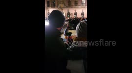 Germany: Man uses pans and buckets as drums during Festival of Lights in Berlin