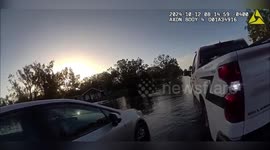 US: Sheriff's Officer Carries Flood-Stranded Passengers to Safety