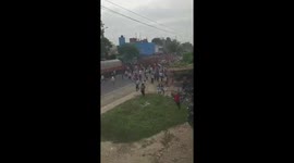 Elephant attacks cars at religious festival in India