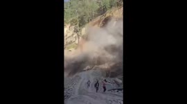 Workers run from huge landslide in northern India