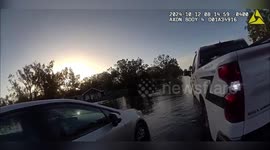 Cop carries stranded driver and passenger to safety through Florida flood