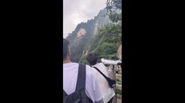 Crowds queue on mountain during popular hiking day in China
