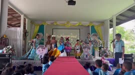 Schoolboy tumbles from walkway at class fashion show