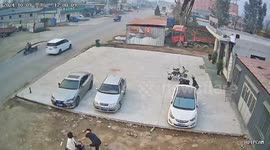 Shopkeeper clings to roof when ladder suddenly slips away
