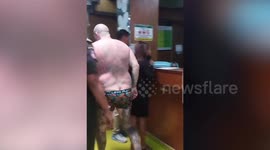 Heavily tattooed Aussie 'bogan' causing a disturbance detained by police in Bali