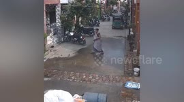 Water tank falls from roof and lands perfectly square on top of woman in India