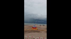 Rare curved waterspout spotted over lake in China