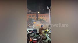 Blaze in red Porsche refuses to go out despite two hoses from firemen