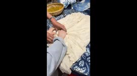 Woman creates stunning tie-dyed navy blue dress in China