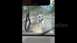 China: A giant inflatable soccer ball came to a stop on the road