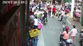 Clumsy motorist slams into reverse and ploughs into people on busy street