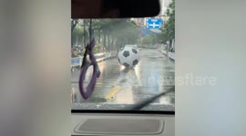 Giant inflatable football blocks traffic on road in China