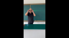 Teacher shows how reading and bifocal glasses affects light