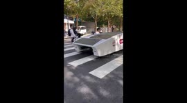 Solar-powered car cruises along road on sunny day in China