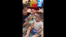Baby's joy as colorful windmill touches forehead in  China